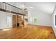 Spacious living room with wood floors, vaulted ceiling, and fireplace, offering natural light at 3605 Moonlight Dr, Chapel Hill, NC 27516