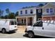 Two-story home with modern facade, large windows, and welcoming porch in a neighborhood setting at 3701 Rosebush Dr, Zebulon, NC 27597