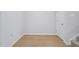 Basement with wood-look floors and a white door at 3705 Rosebush Dr, Zebulon, NC 27597