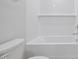 Bright white bathroom with subway tile and tub and shower combo at 3705 Rosebush Dr, Zebulon, NC 27597