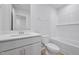 This bathroom has bright white walls, cabinetry, and subway tile at 3705 Rosebush Dr, Zebulon, NC 27597