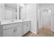 Well-lit bathroom showcasing double vanities, framed mirrors, and white cabinets offering ample storage space at 3705 Rosebush Dr, Zebulon, NC 27597