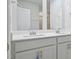 Elegant bathroom featuring double sinks, a quartz countertop, and brushed nickel hardware at 3705 Rosebush Dr, Zebulon, NC 27597