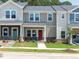 Charming townhomes featuring craftsman-style architecture, covered entryways, and well-manicured lawns create inviting curb appeal at 3705 Rosebush Dr, Zebulon, NC 27597