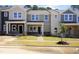 New townhomes with modern facades, landscaped yards, and inviting entryways at 3705 Rosebush Dr, Zebulon, NC 27597