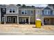 New townhomes featuring modern designs, varied color palettes and construction in progress at 3705 Rosebush Dr, Zebulon, NC 27597