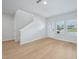Spacious living area with hardwood floors, a staircase, and ample natural light at 3705 Rosebush Dr, Zebulon, NC 27597