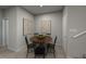 Cozy dining room with modern decor, a round wooden table, and seating for four at 3709 Rosebush Dr, Zebulon, NC 27597