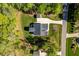 Aerial view of a well-maintained home with a landscaped yard and a long driveway at 3805 Watermark Dr, Franklinton, NC 27525