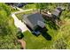 Aerial view of a beautiful home with a green lawn, a screened in porch and a stone patio at 3805 Watermark Dr, Franklinton, NC 27525