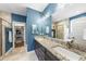 Granite countertops and a large mirror highlight this bathroom's elegant style at 3805 Watermark Dr, Franklinton, NC 27525