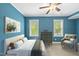 Bright bedroom with large windows, ceiling fan, and neutral colored decor at 3805 Watermark Dr, Franklinton, NC 27525