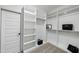 Organized walk-in closet with ample shelving and hanging space with white walls and carpet at 3805 Watermark Dr, Franklinton, NC 27525