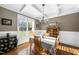 Elegant dining room with hardwood floors, coffered ceilings, and a vintage china cabinet at 3805 Watermark Dr, Franklinton, NC 27525