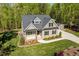 Attractive home with a well-maintained lawn, black roof, and professional landscaping at 3805 Watermark Dr, Franklinton, NC 27525
