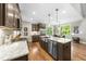 Bright kitchen featuring stainless steel appliances, granite countertops, and an island at 3805 Watermark Dr, Franklinton, NC 27525