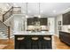 Spacious kitchen features granite countertops, stainless appliances, a center island, and hardwood floors at 3805 Watermark Dr, Franklinton, NC 27525