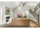Inviting living room featuring a fireplace, vaulted ceilings, hardwood floors and staircase at 3805 Watermark Dr, Franklinton, NC 27525