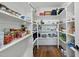 Walk-in pantry featuring custom shelving to maximize storage and organization at 3805 Watermark Dr, Franklinton, NC 27525