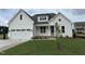 Beautiful two-story home with attached garage, landscaped lawn and inviting front door at 3820 Fairway View Dr # 16, Fuquay Varina, NC 27526