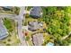 An aerial view of the home, showing it's backyard, surrounding trees, neighboring properties, and street at 3832 Crimson Clover Ave, Wake Forest, NC 27587