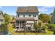 View of the backyard, deck, patio furniture, screened porch, and neutral exterior on a sunny day at 3832 Crimson Clover Ave, Wake Forest, NC 27587