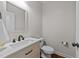 This modern bathroom features a sleek vanity, updated fixtures, and a large mirror at 3832 Crimson Clover Ave, Wake Forest, NC 27587
