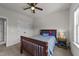 Cozy bedroom features a ceiling fan, plush carpet, and a full size bed with wood frame at 3832 Crimson Clover Ave, Wake Forest, NC 27587