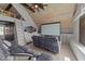 Attic bonus room featuring a movie screen, custom built-ins, wooden ceiling and a gray sofa at 3832 Crimson Clover Ave, Wake Forest, NC 27587