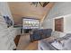 Cozy bonus room with wood ceiling, a projector screen, and comfortable gray seating for entertainment at 3832 Crimson Clover Ave, Wake Forest, NC 27587