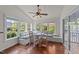 Charming breakfast nook with bench seating, bright windows, and a ceiling fan for comfortable dining at 3832 Crimson Clover Ave, Wake Forest, NC 27587
