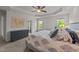 This main bedroom features neutral decor, carpet flooring, and abundant natural light at 3832 Crimson Clover Ave, Wake Forest, NC 27587