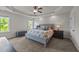 Spacious main bedroom features neutral decor, carpet flooring, tray ceiling and abundant natural light at 3832 Crimson Clover Ave, Wake Forest, NC 27587