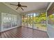 Relax on this screened porch with a ceiling fan and enjoy the lush backyard at 3832 Crimson Clover Ave, Wake Forest, NC 27587