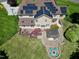 Stunning home with solar panels, a large deck, patio, firepit, and lush landscaping creates an amazing backyard oasis at 4001 Belmont Forest Way, Raleigh, NC 27606