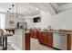 Finished basement offers a wet bar with granite countertop and stainless refrigerator at 4001 Belmont Forest Way, Raleigh, NC 27606