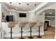 Basement bar with granite countertops and bar stool seating for casual dining at 4001 Belmont Forest Way, Raleigh, NC 27606