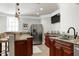 Wet bar features a granite countertop, stainless appliances and plenty of cabinet space at 4001 Belmont Forest Way, Raleigh, NC 27606