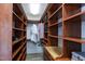 Large custom closet with abundant storage, pull out drawers, and wooden shelving at 4001 Belmont Forest Way, Raleigh, NC 27606