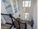 Grand two-story foyer with elegant chandelier and staircase creates an inviting entrance at 4001 Belmont Forest Way, Raleigh, NC 27606