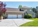 Exterior shot of three-car attached garage with a basketball hoop next to green grass at 4001 Belmont Forest Way, Raleigh, NC 27606