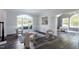 Bright living room featuring modern decor, large windows, and stylish furnishings at 4001 Belmont Forest Way, Raleigh, NC 27606