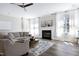 Comfortable living room featuring a fireplace, hardwood floors, and natural light at 4001 Belmont Forest Way, Raleigh, NC 27606