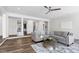 Open concept living room with modern sofa, hardwood floors, and stylish decor at 4001 Belmont Forest Way, Raleigh, NC 27606