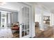 Sunlit living room with modern furniture and view into dining area at 4001 Belmont Forest Way, Raleigh, NC 27606