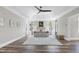 Spacious primary bedroom featuring tray ceiling, large windows, and hardwood floors at 4001 Belmont Forest Way, Raleigh, NC 27606