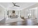 Expansive primary bedroom with tray ceiling, large windows, and neutral decor provides a serene retreat at 4001 Belmont Forest Way, Raleigh, NC 27606
