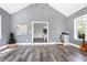 A well lit music room, featuring a vaulted ceiling, hardwood floors, and instruments at 4001 Belmont Forest Way, Raleigh, NC 27606