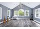 Spacious music room with vaulted ceiling, large windows and hardwood floors at 4001 Belmont Forest Way, Raleigh, NC 27606