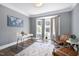 Bright home office with bay window, modern desk, and stylish decor at 4001 Belmont Forest Way, Raleigh, NC 27606